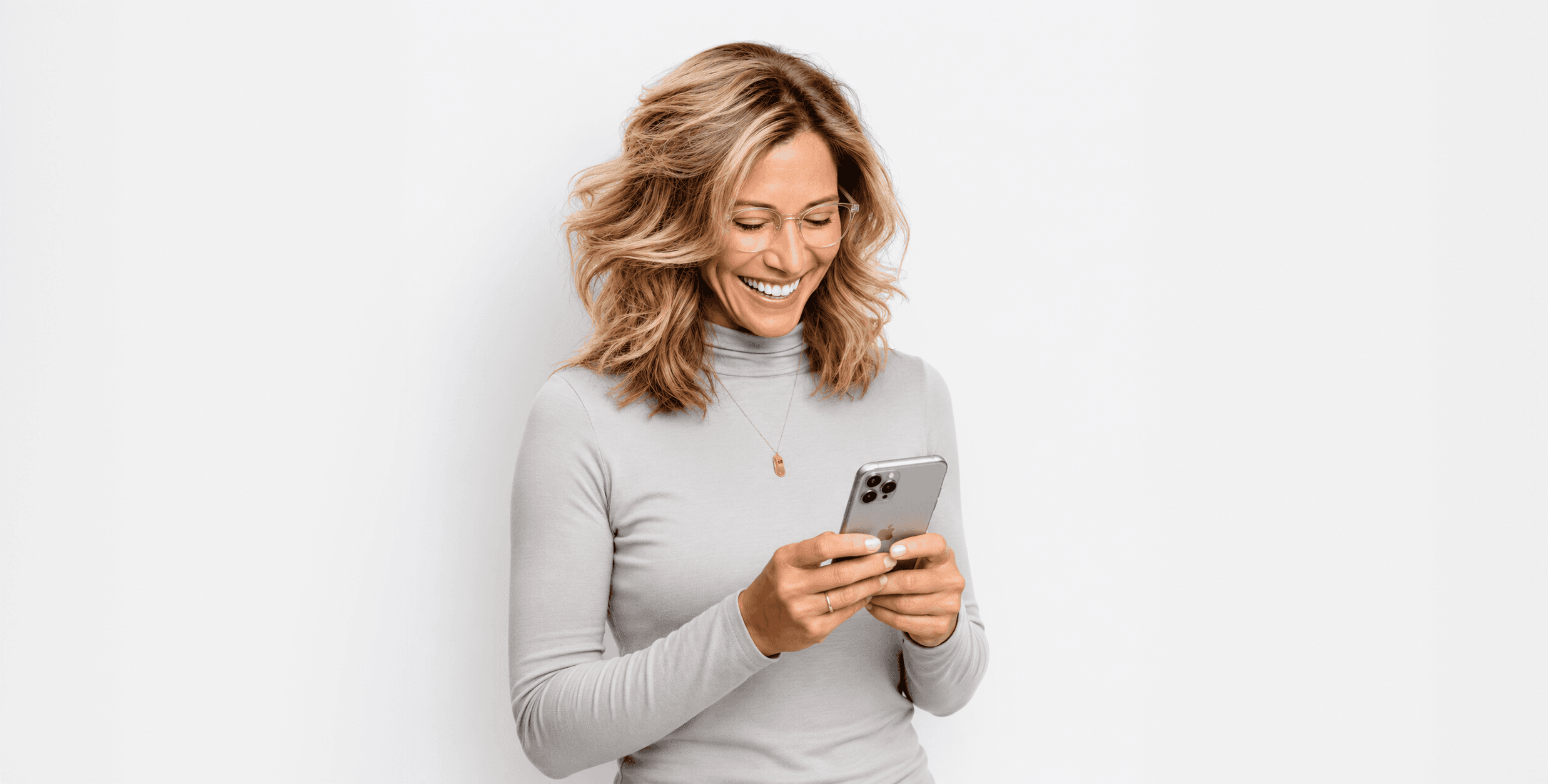 Smiling woman holding a phone